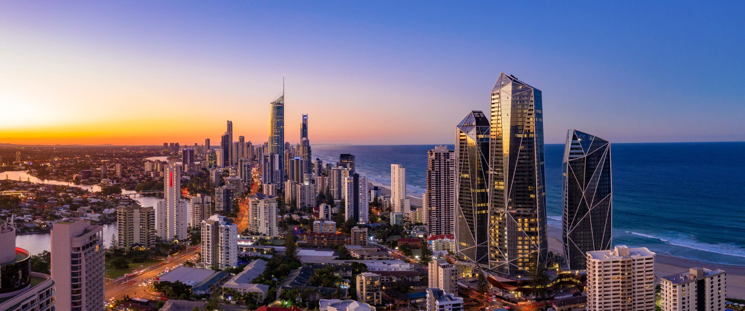 Sunset view of city skyline and ocean