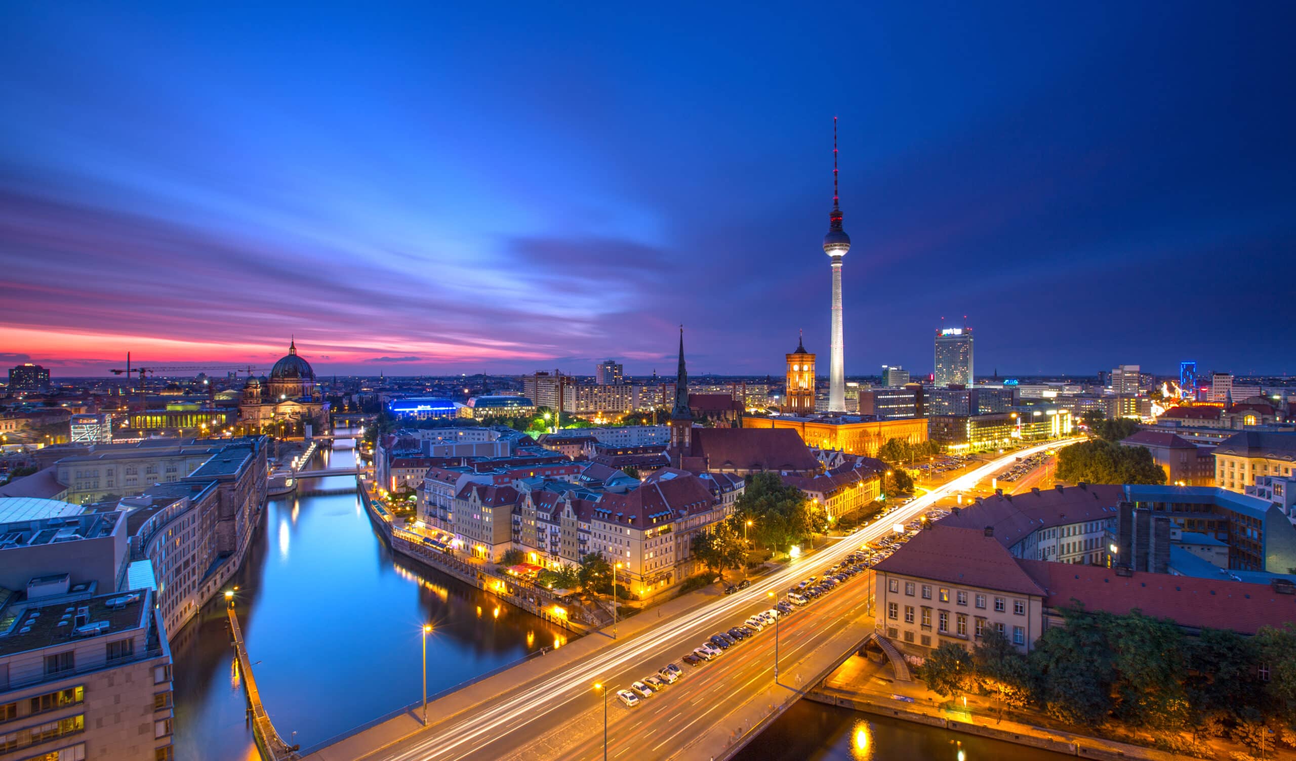Berlin cityscape at dusk with TV tower.