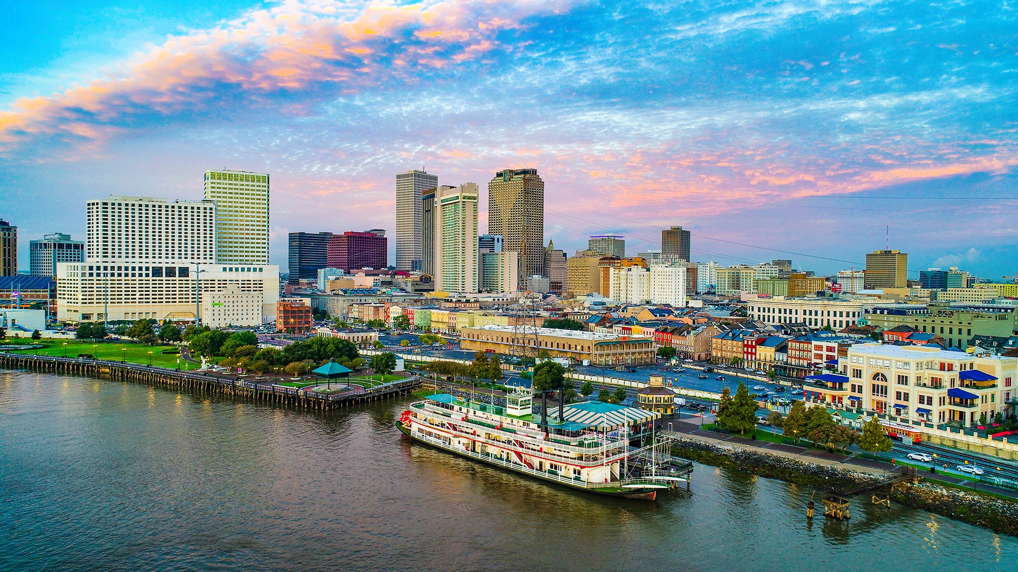 New Orleans skyline with riverboat at sunset